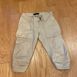 Cream color soft leather over knee pants. Plain Sud.